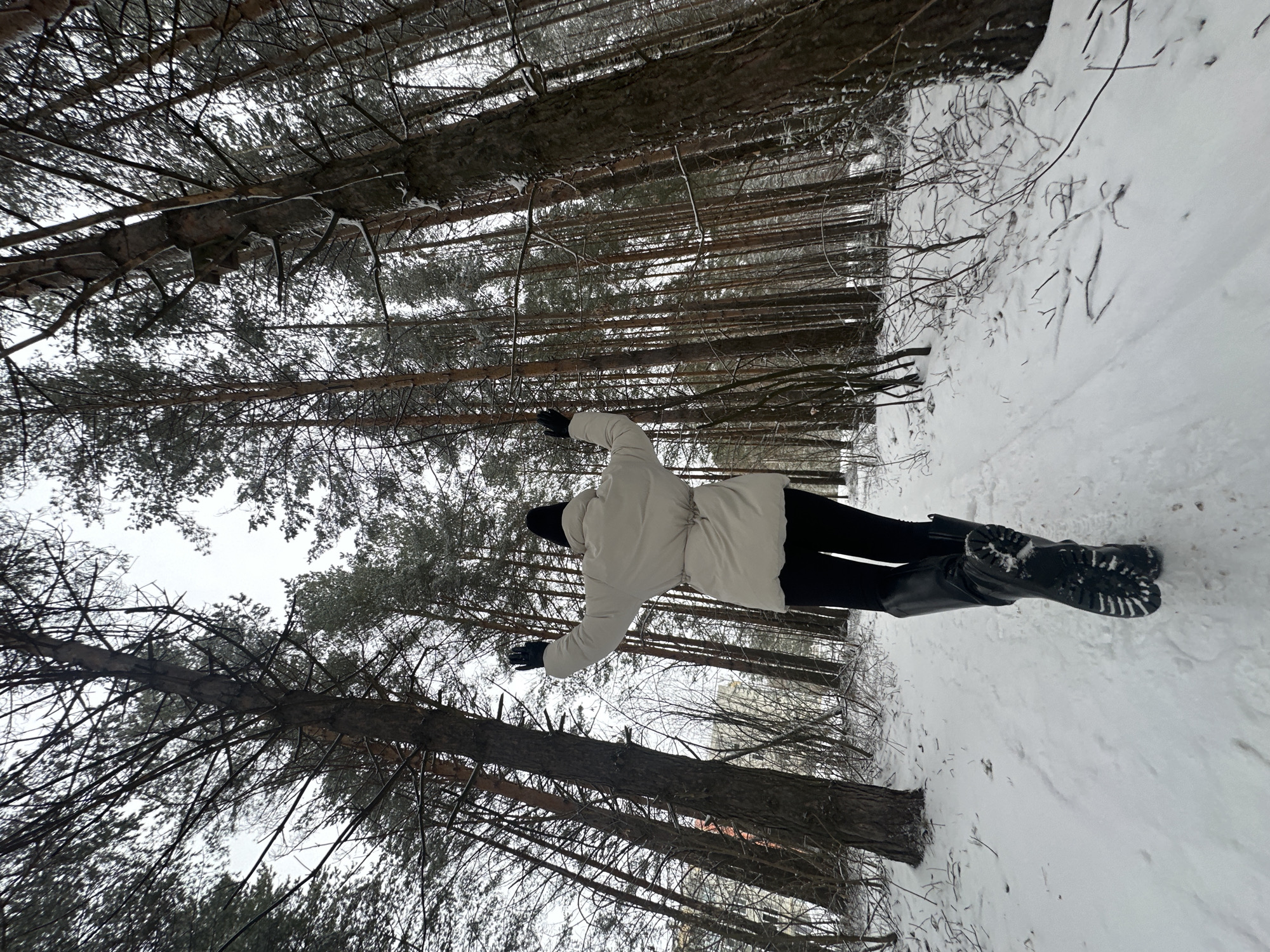 Woman photographed during snowfall in Chaikovsky, Russia