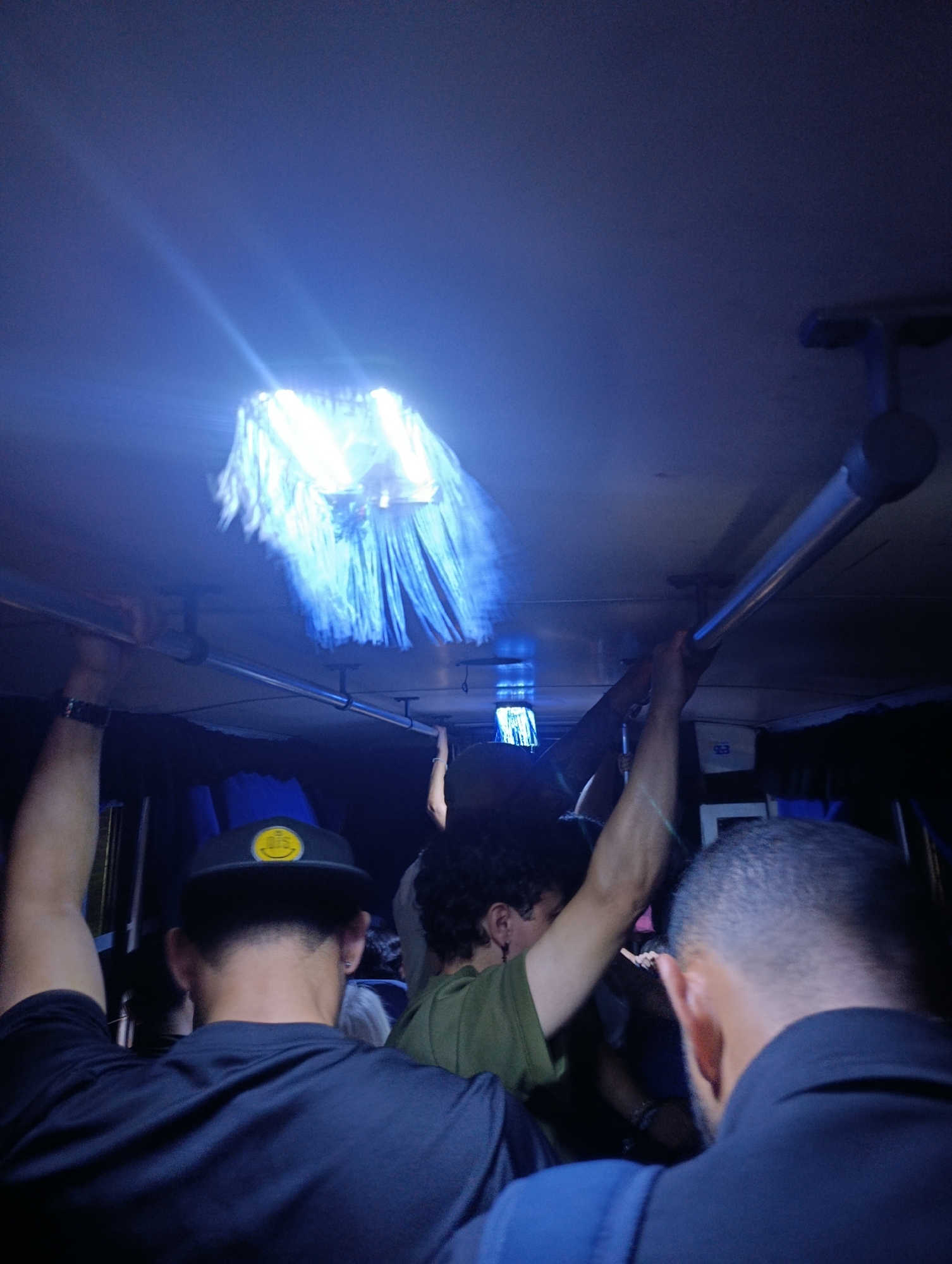 Late night bus passengers photographed in Juan Griego, Venezuela