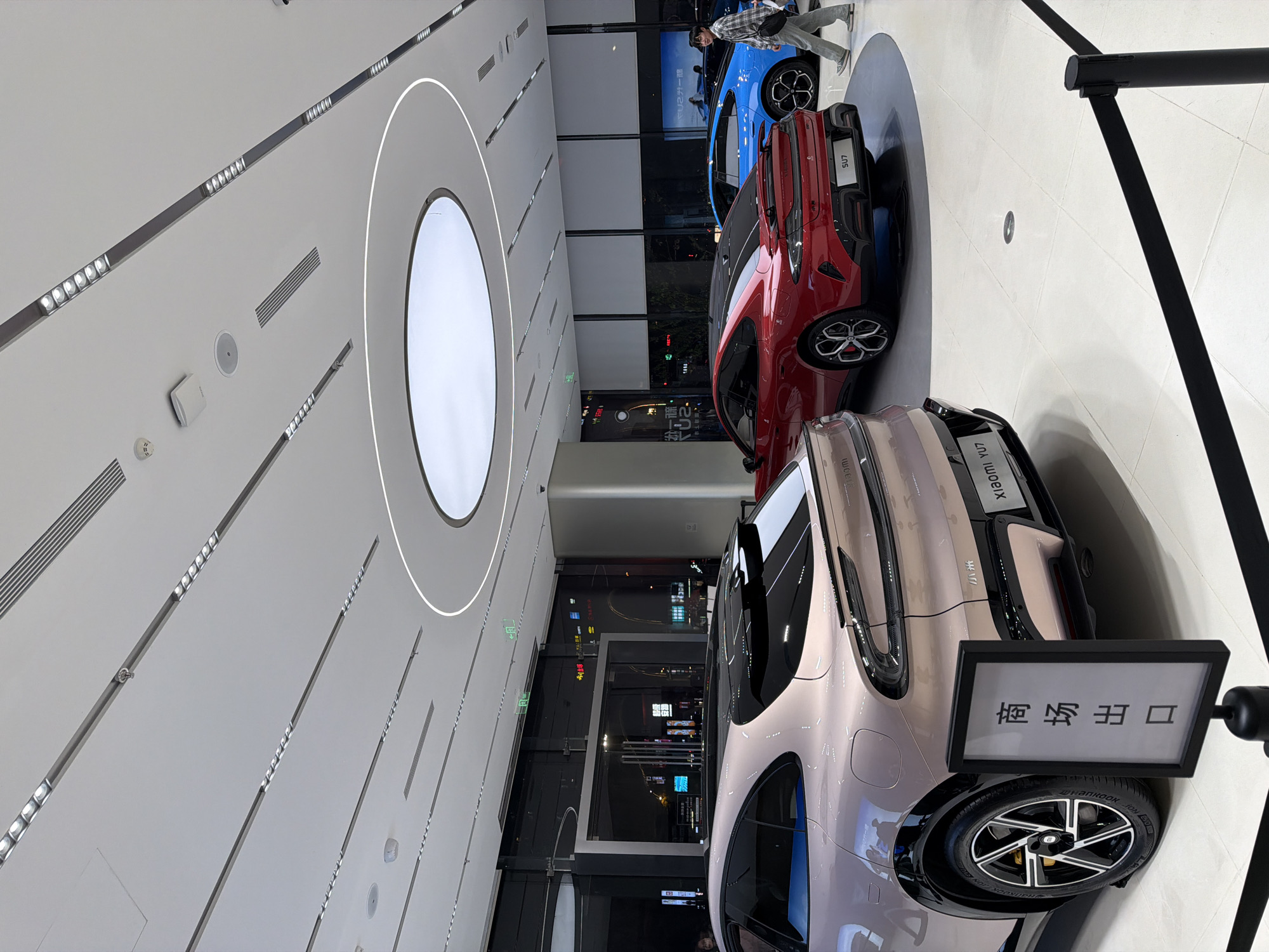 Customers browse Xiaomi electric cars at Jiangning showroom