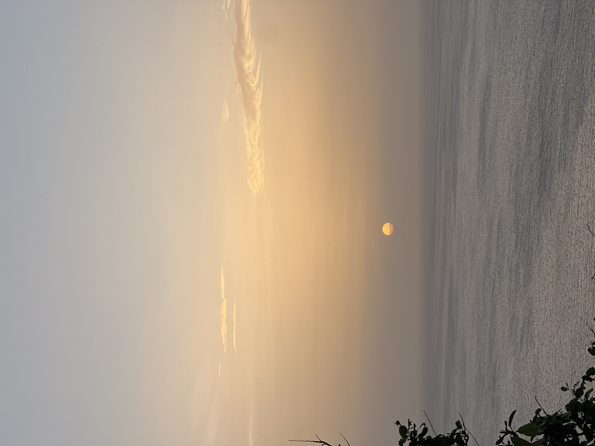 Sun sets and moon rises over San Juan del Sur