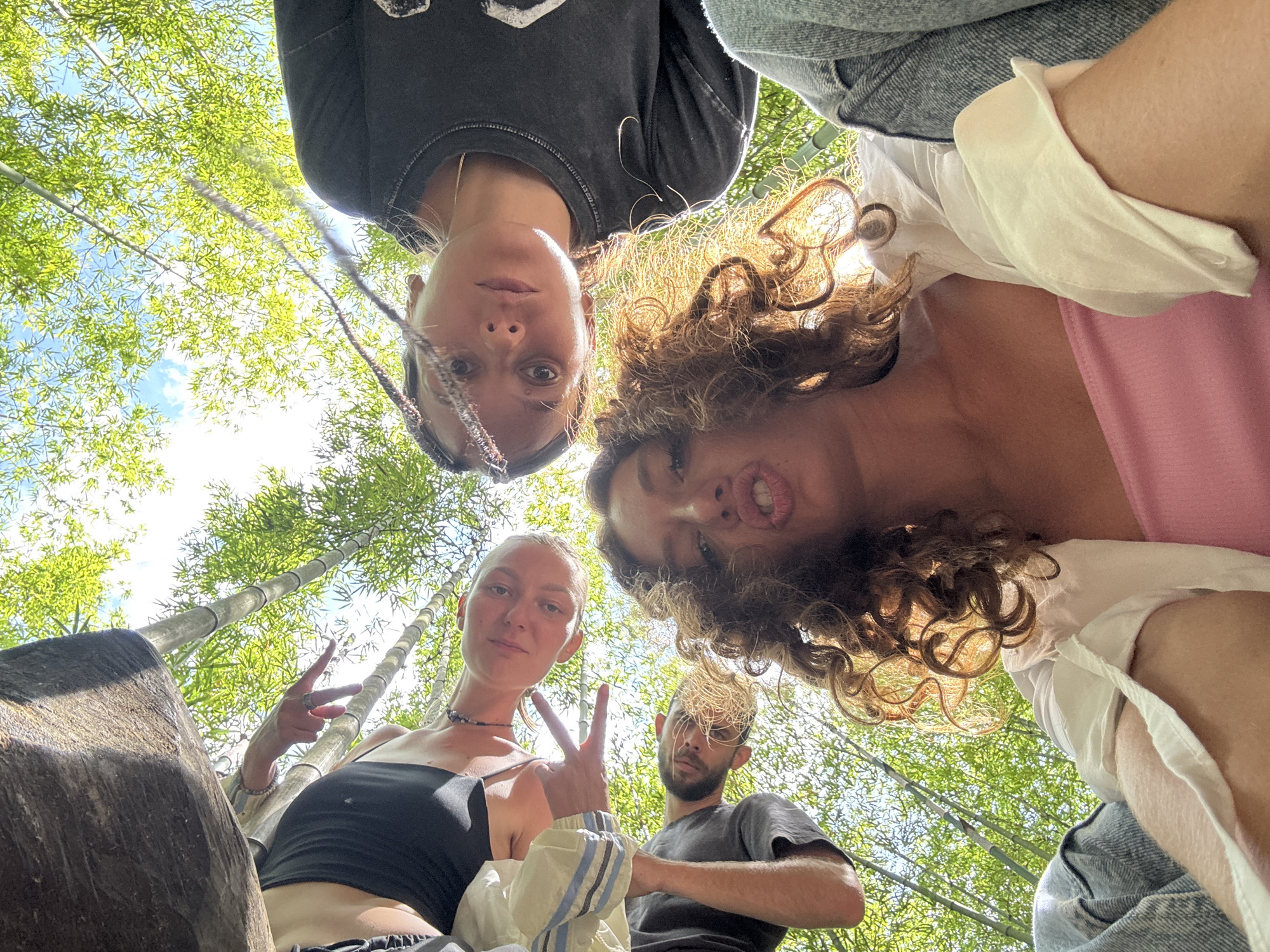 Group photographed in Vietnamese bamboo forest during morning visit