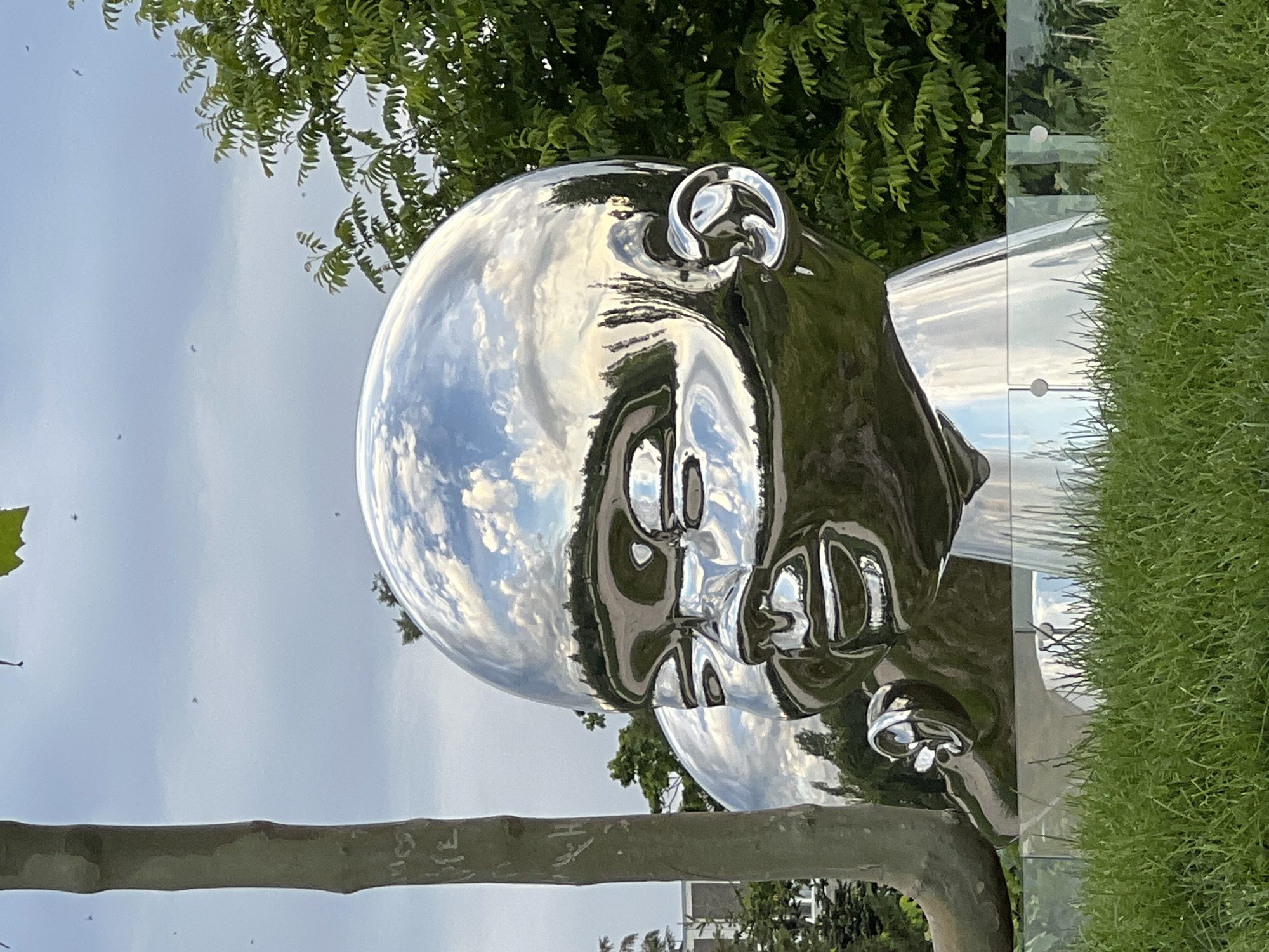 Afternoon park scenes with metallic sculpture documented in Krasnodar