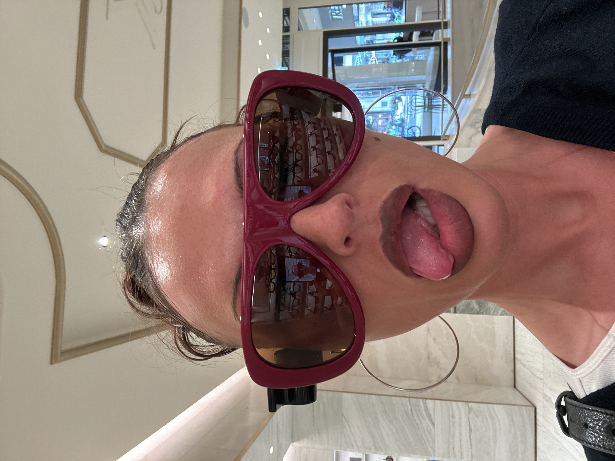 London shopper browses eyewear, books, beauty products during afternoon outing