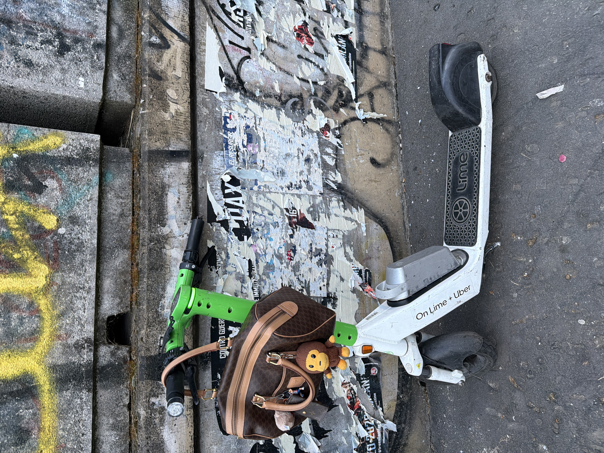Abandoned e-scooter found on Milan street amid graffiti