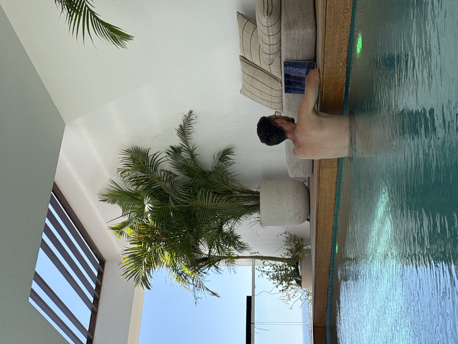 Couple enjoys rooftop pool time in Eilat resort area