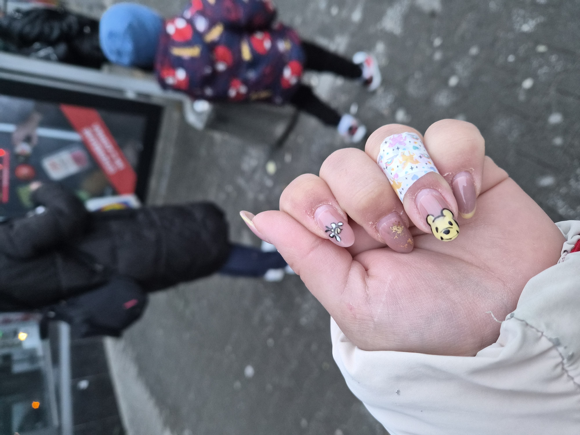 Decorated nail art featuring Winnie the Pooh displayed in Plovdiv