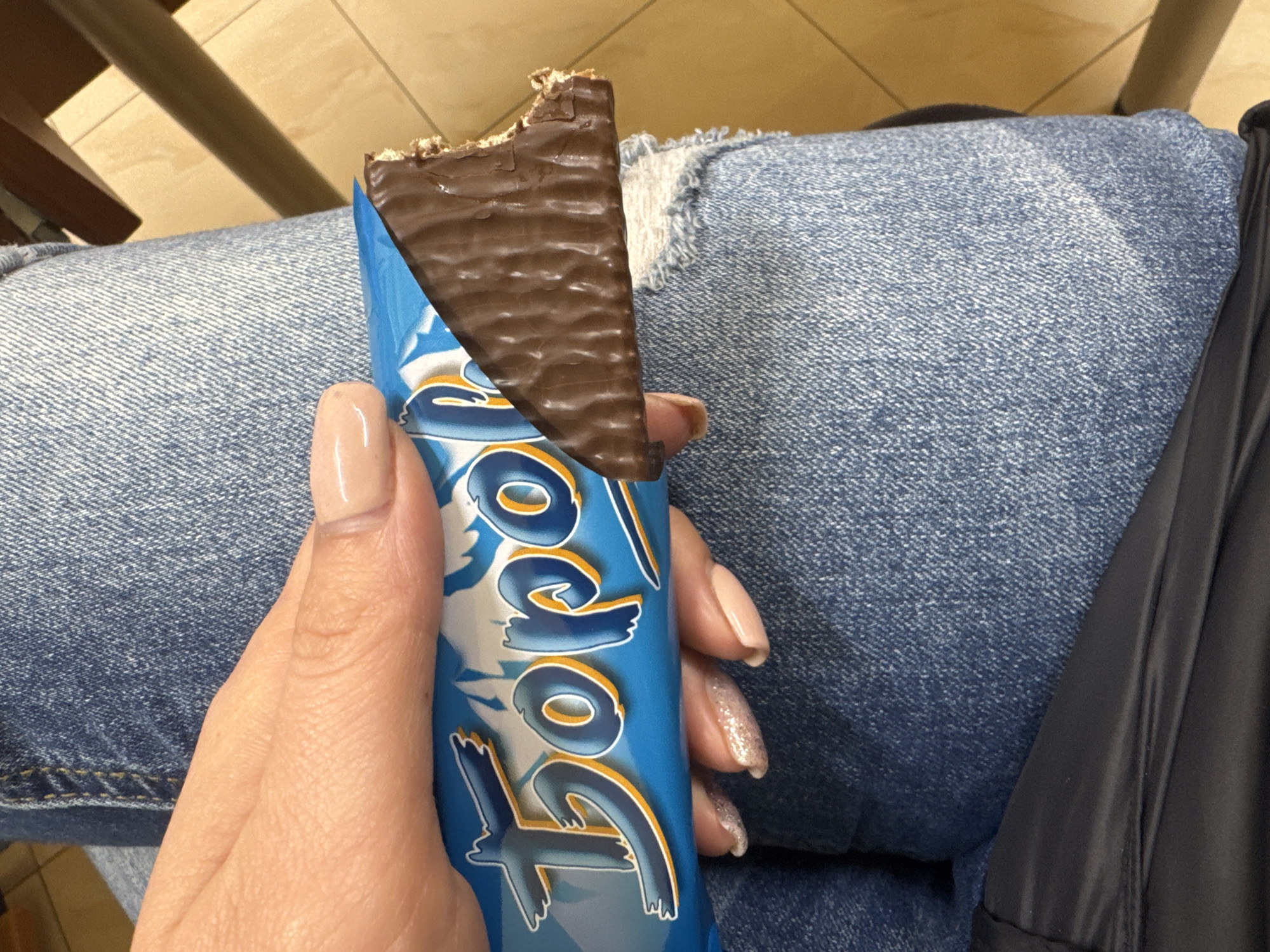 Person enjoys Tono chocolate wafer bar in Plovdiv