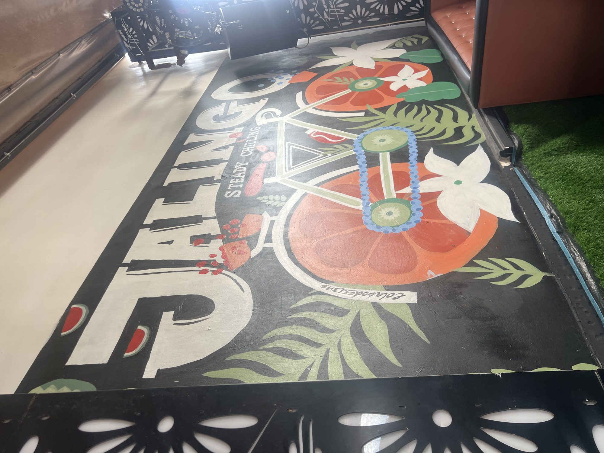 Inside a Nigerian venue: murals, stage setup, and daytime lounging