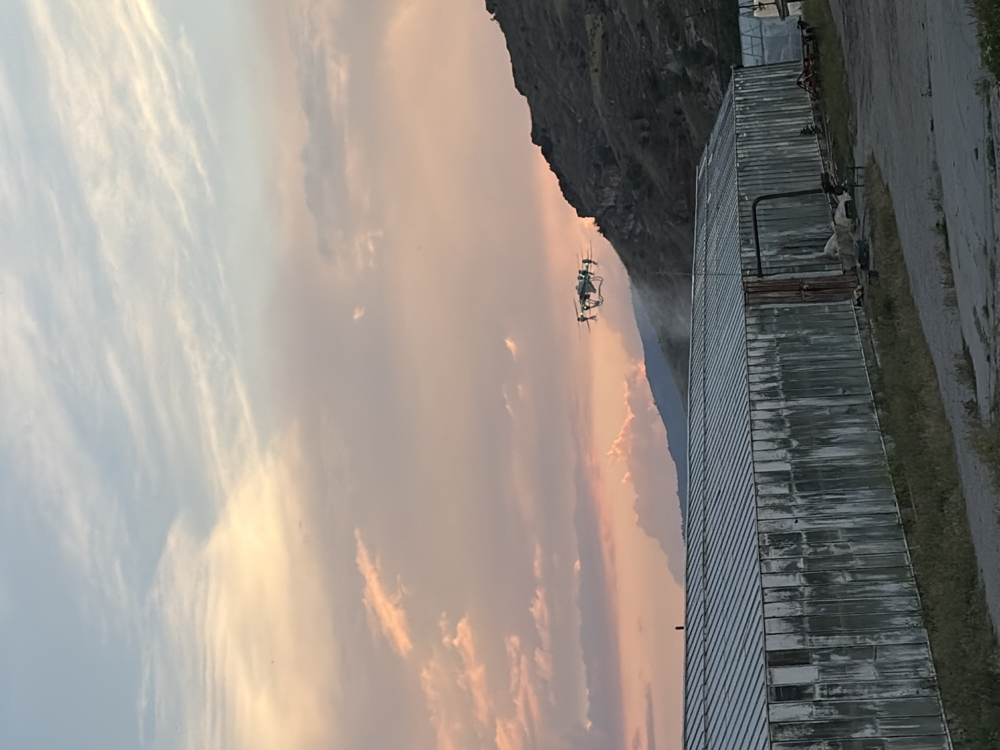 Rural sunset documented with drone presence at unknown location