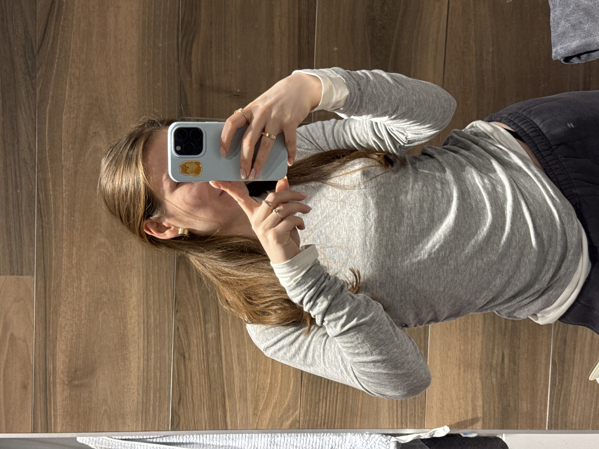 Person takes selfie against wood paneling in Khimki