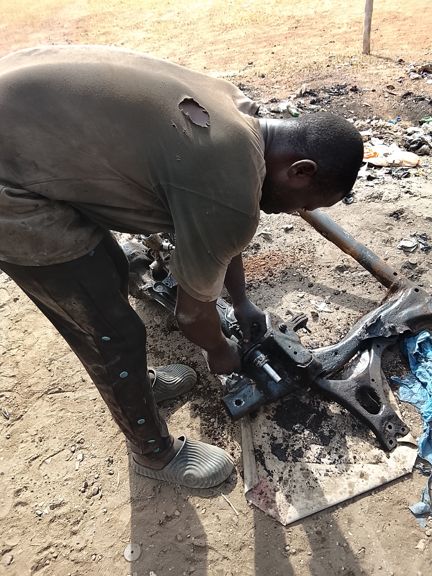 Busy automotive repair district captures daily life in Abuja