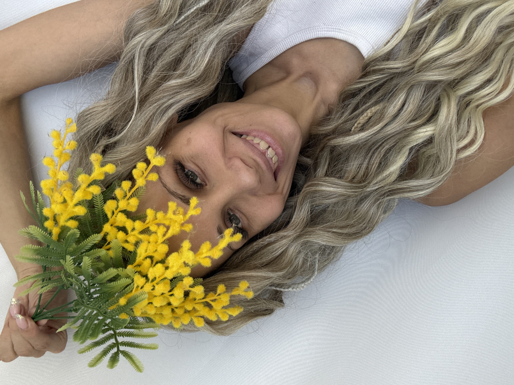 Woman photographed with flowers during morning portrait session in Russia