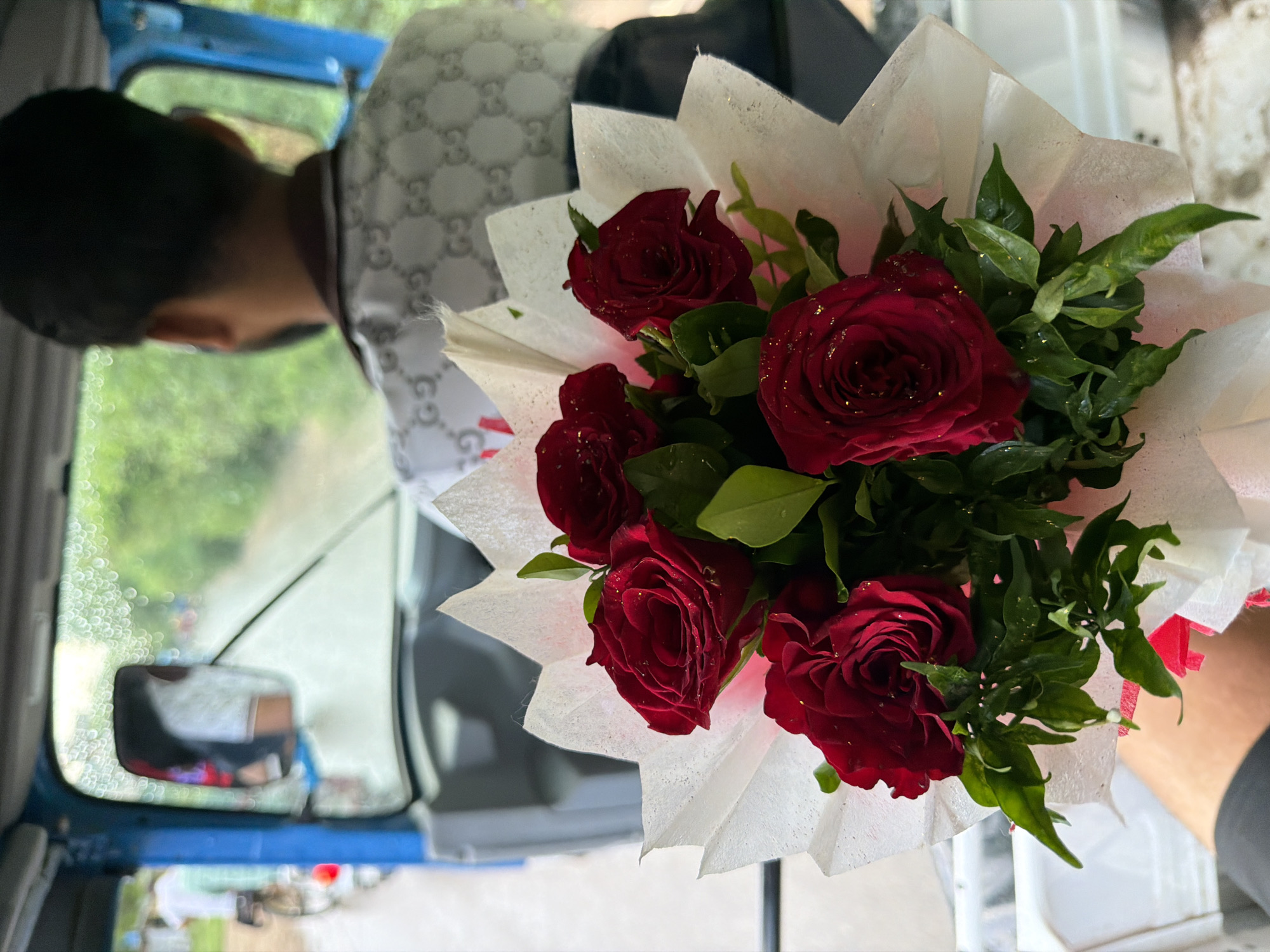 Red roses in transit through Kanpur, seen from every angle
