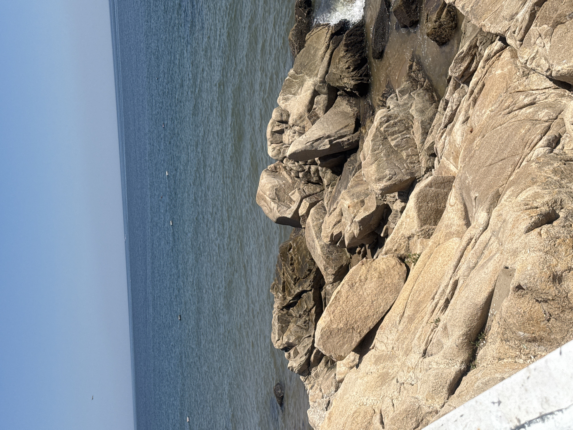 Qinhuangdao coastline: rocky shores, sandy beach, calm sea
