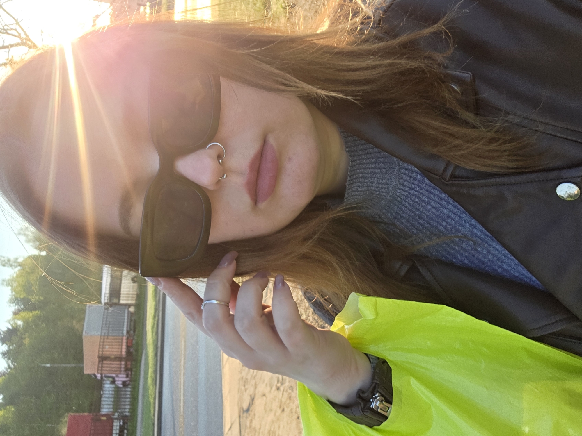 Woman films selfies during early morning outdoor walk