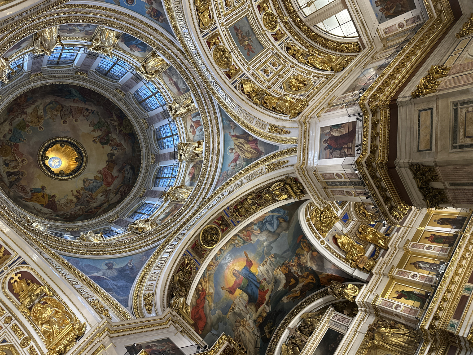 Tourists photograph ornate interior of Saint Isaac's Cathedral