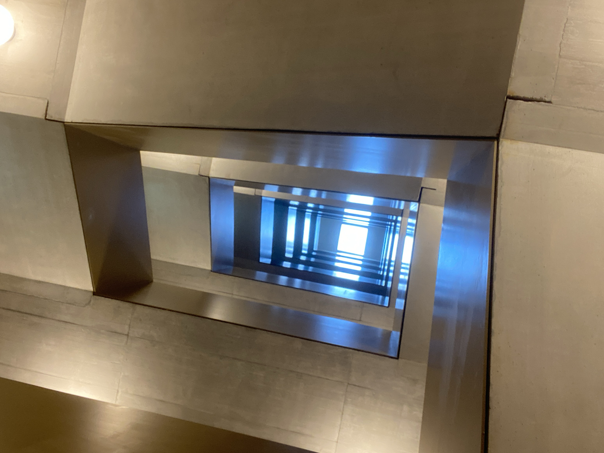 Upward staircase view captured in Kriens, Switzerland