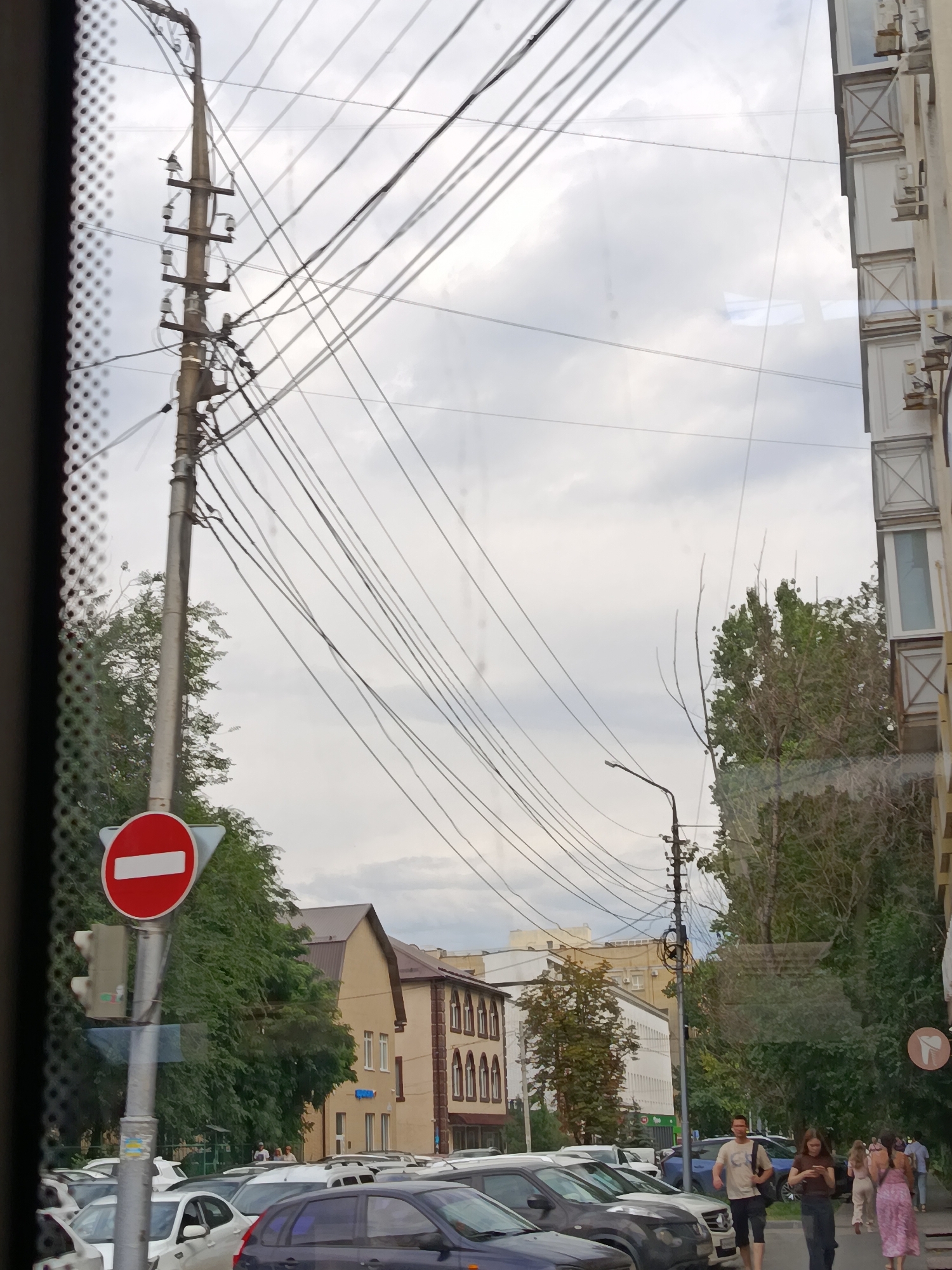 Street-level look at everyday Saratov — shops, traffic, and old facades