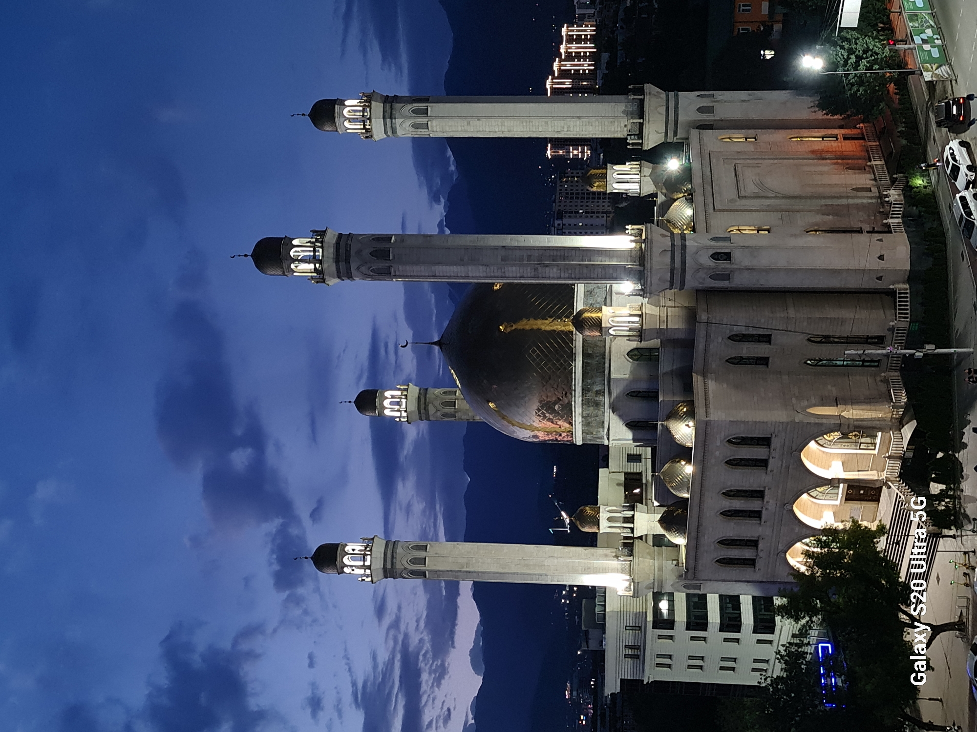 Almaty's Central Mosque glows at dusk from every angle