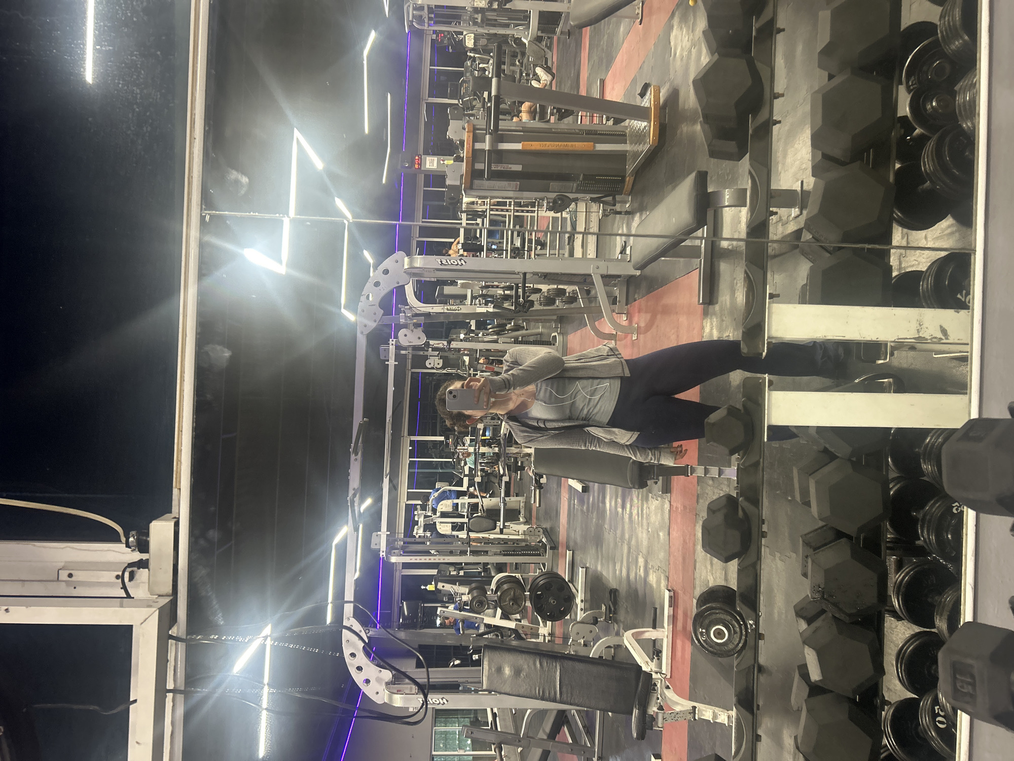 Woman takes gym selfie during early morning workout session