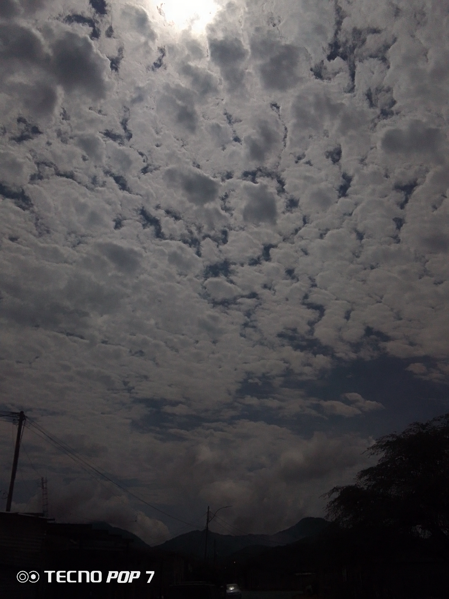 Dramatic cloud formations shift over Altagracia, Venezuela afternoon