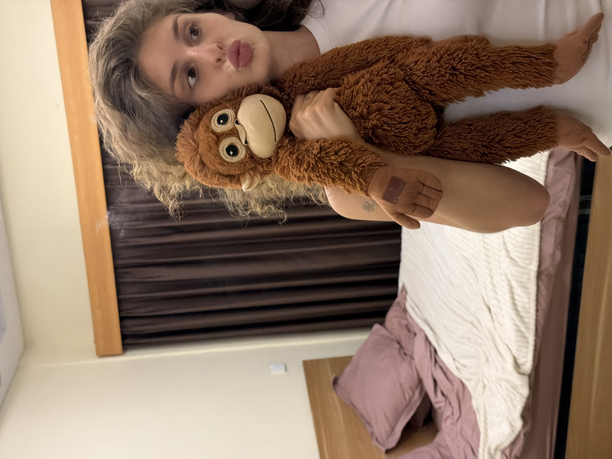 Bedroom selfies with a stuffed monkey in North Kuta
