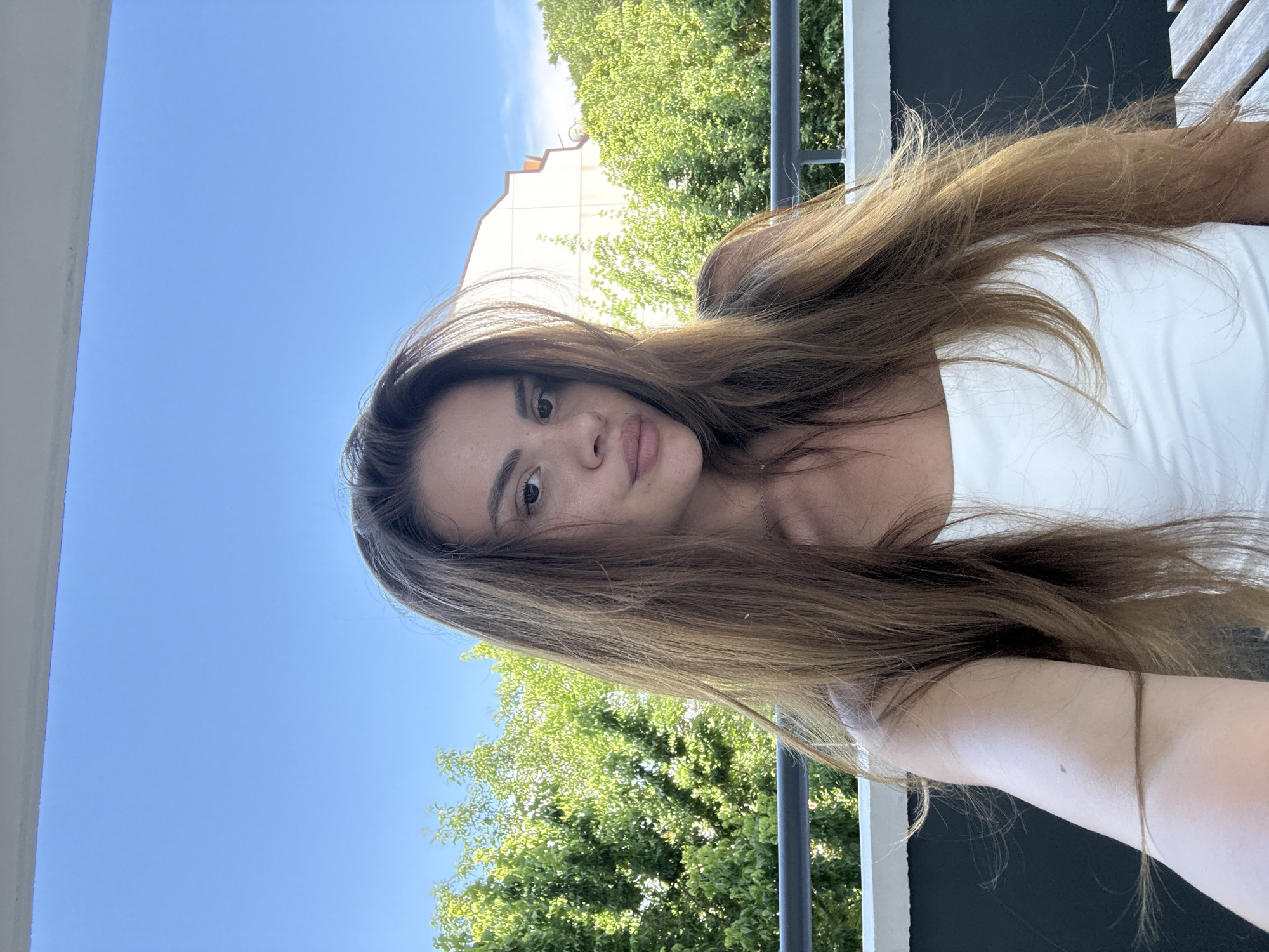 Woman Takes Extended Selfie Session on Plovdiv Balcony