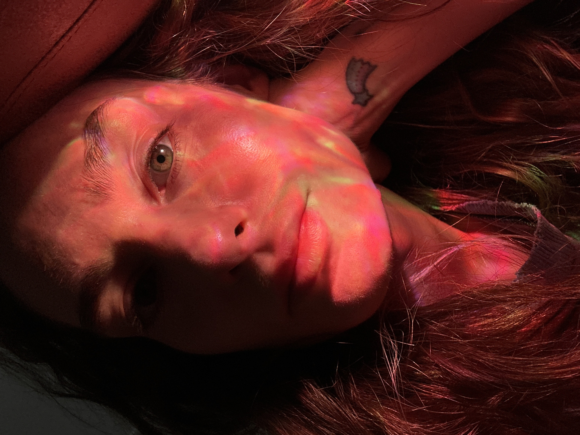 Person filmed with colored lighting effects in Kiel portrait session