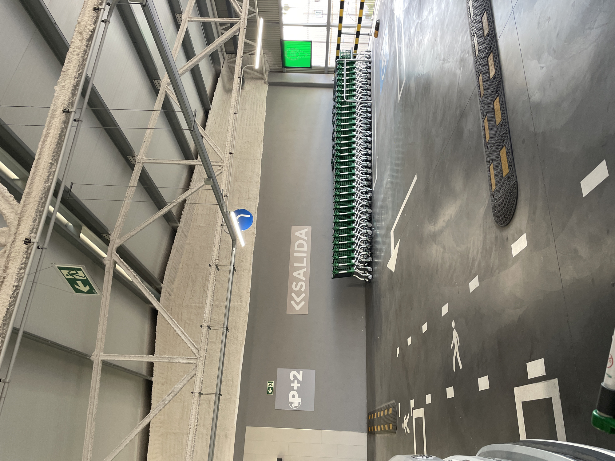 Shopping cart and parking lot at a large retail store