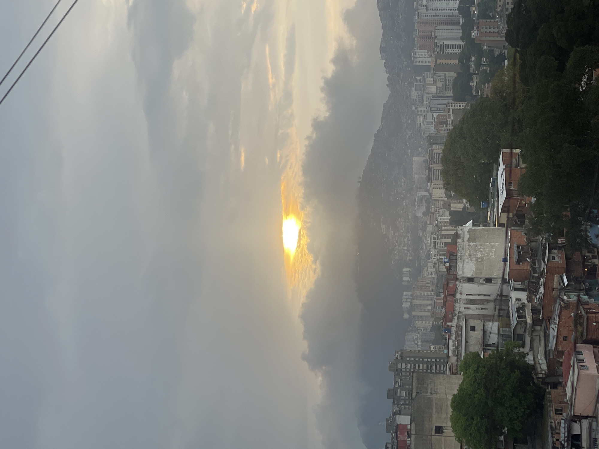 Caracas cityscape documented under cloudy evening skies