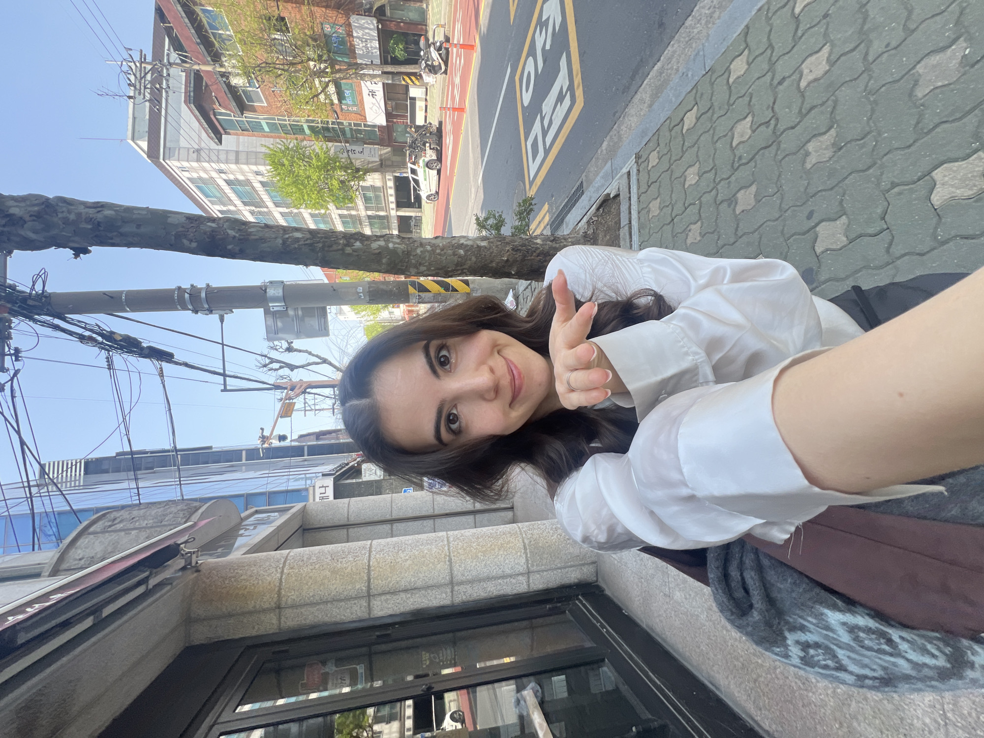 Woman takes peace sign selfie in Seoul