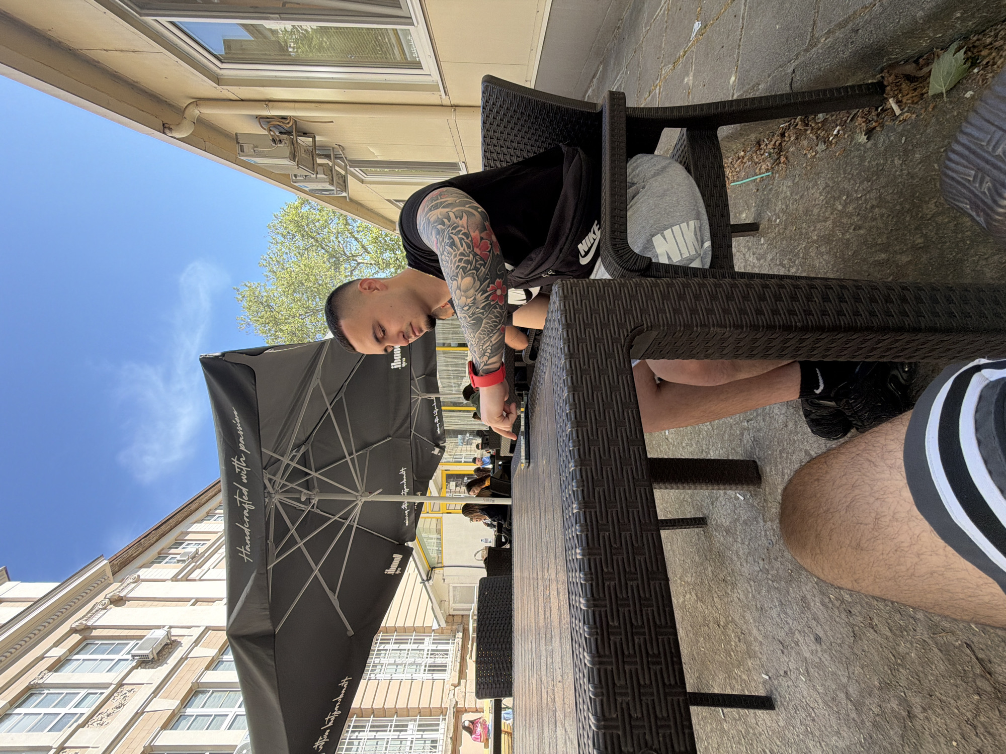 Two men enjoy morning coffee at Plovdiv cafe