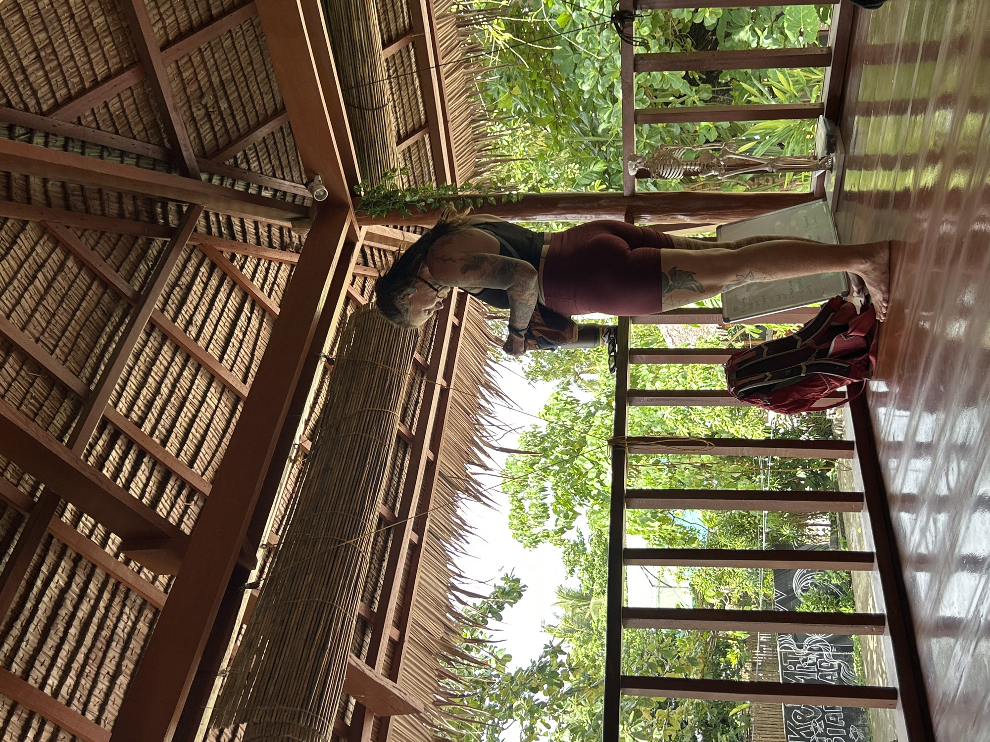 Woman practices yoga at tropical retreat in General Luna