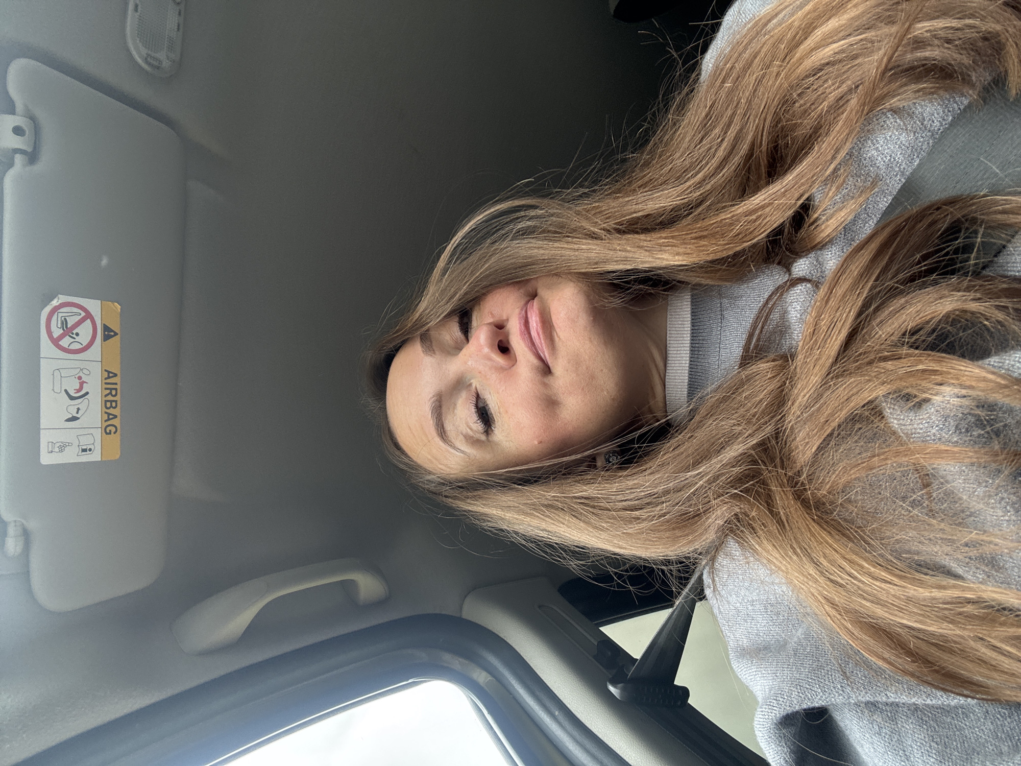 Woman photographed inside vehicle in Povarёnki, Russia