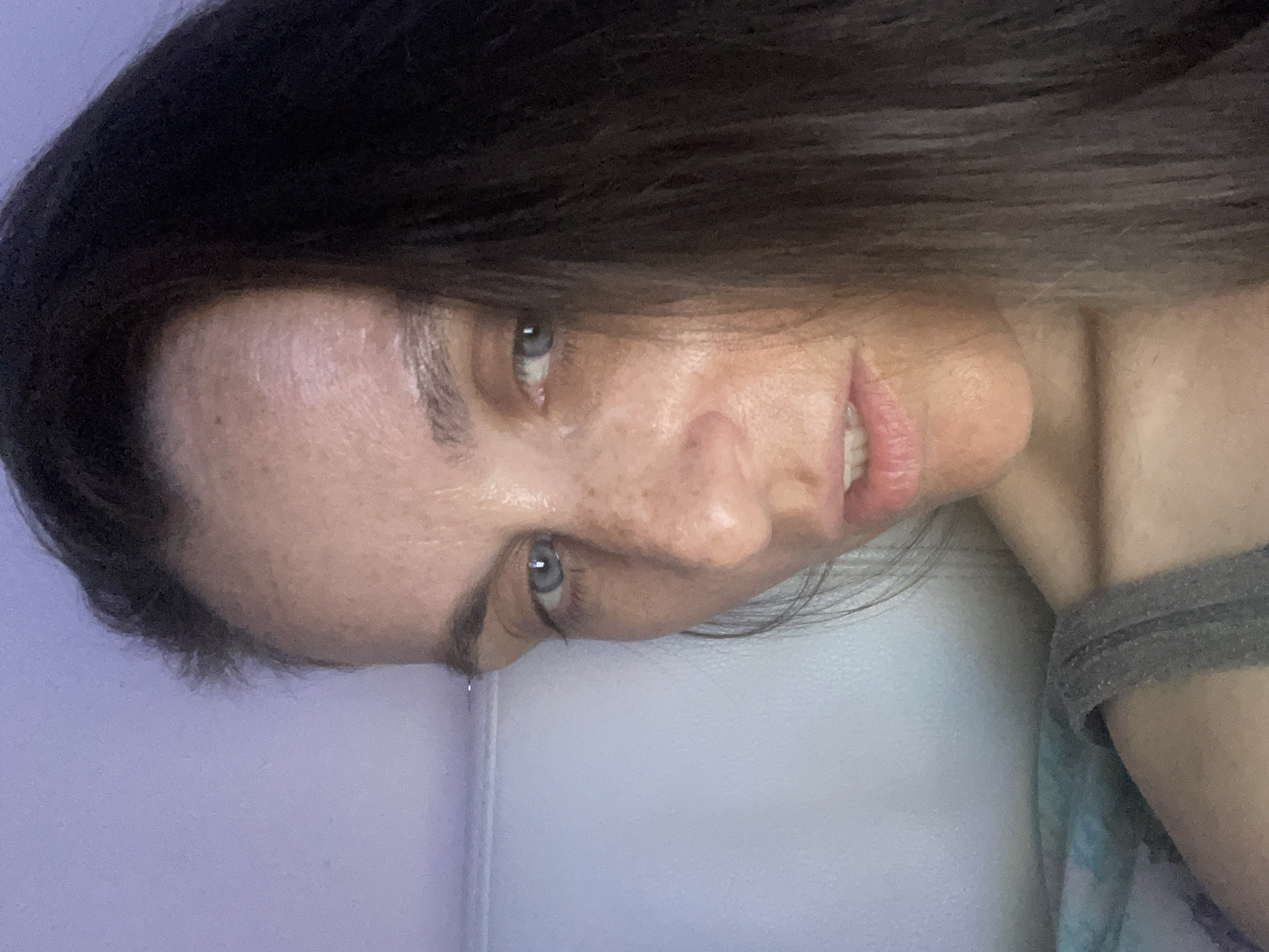 Relaxing at home with a blanket and TV remote