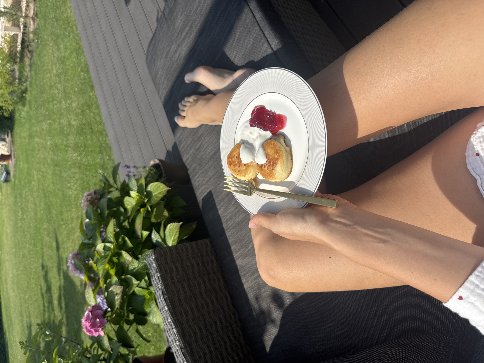 Pancakes and cream on a deck in coastal Latvia