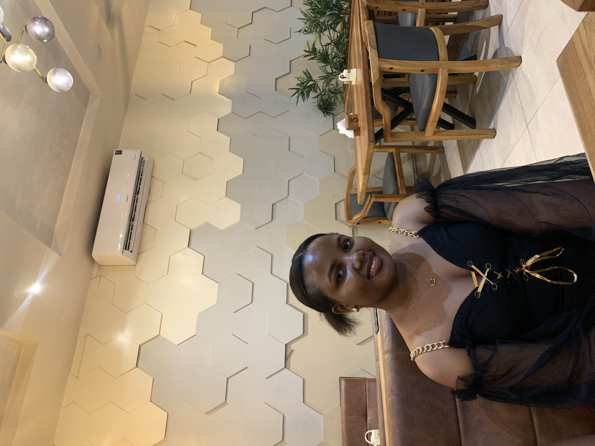 Women photographed at Dar es Salaam cafe during evening social gathering