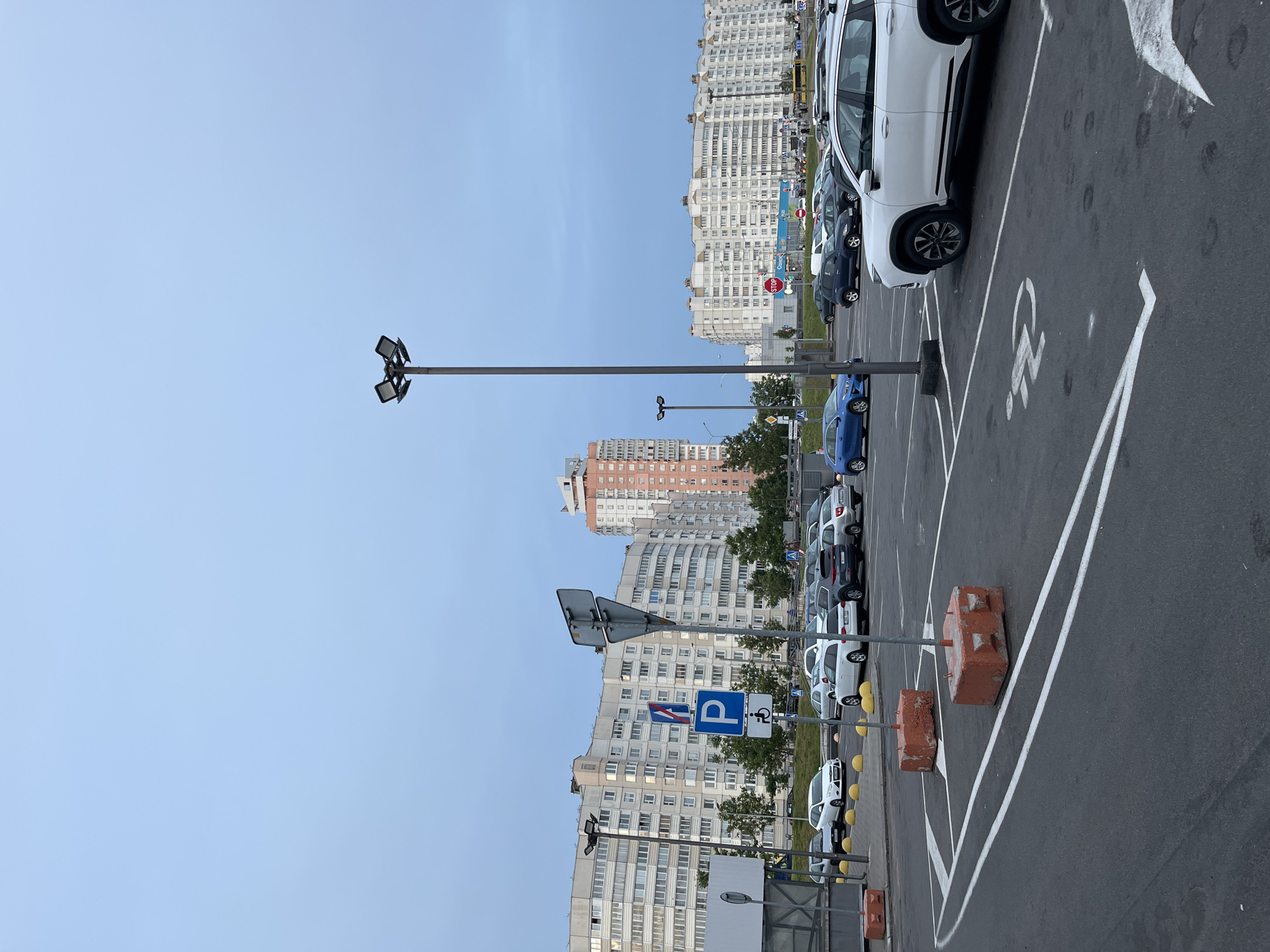 Parking lot and high-rises on a clear afternoon in Minsk