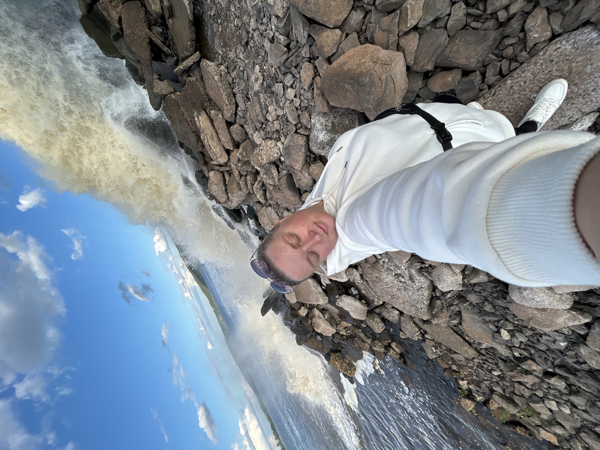 Woman takes selfies by turbulent waters in Chernushka, Russia