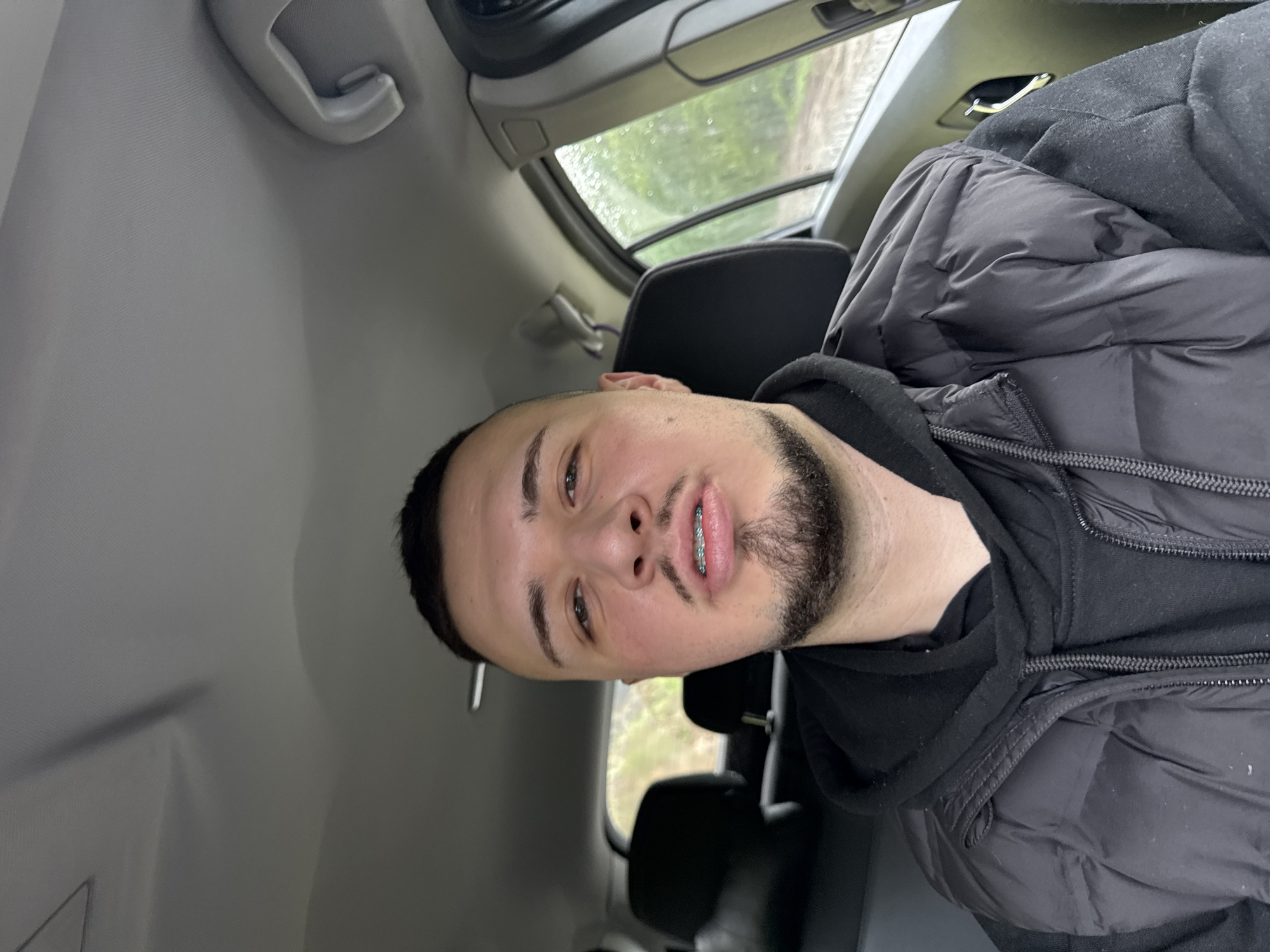 Man in winter clothing observed in vehicle, Smolyan Bulgaria