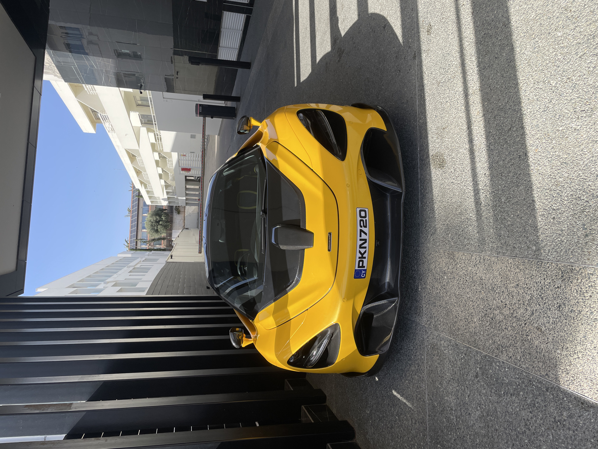 Yellow McLaren draws attention from local boys in Ayia Napa