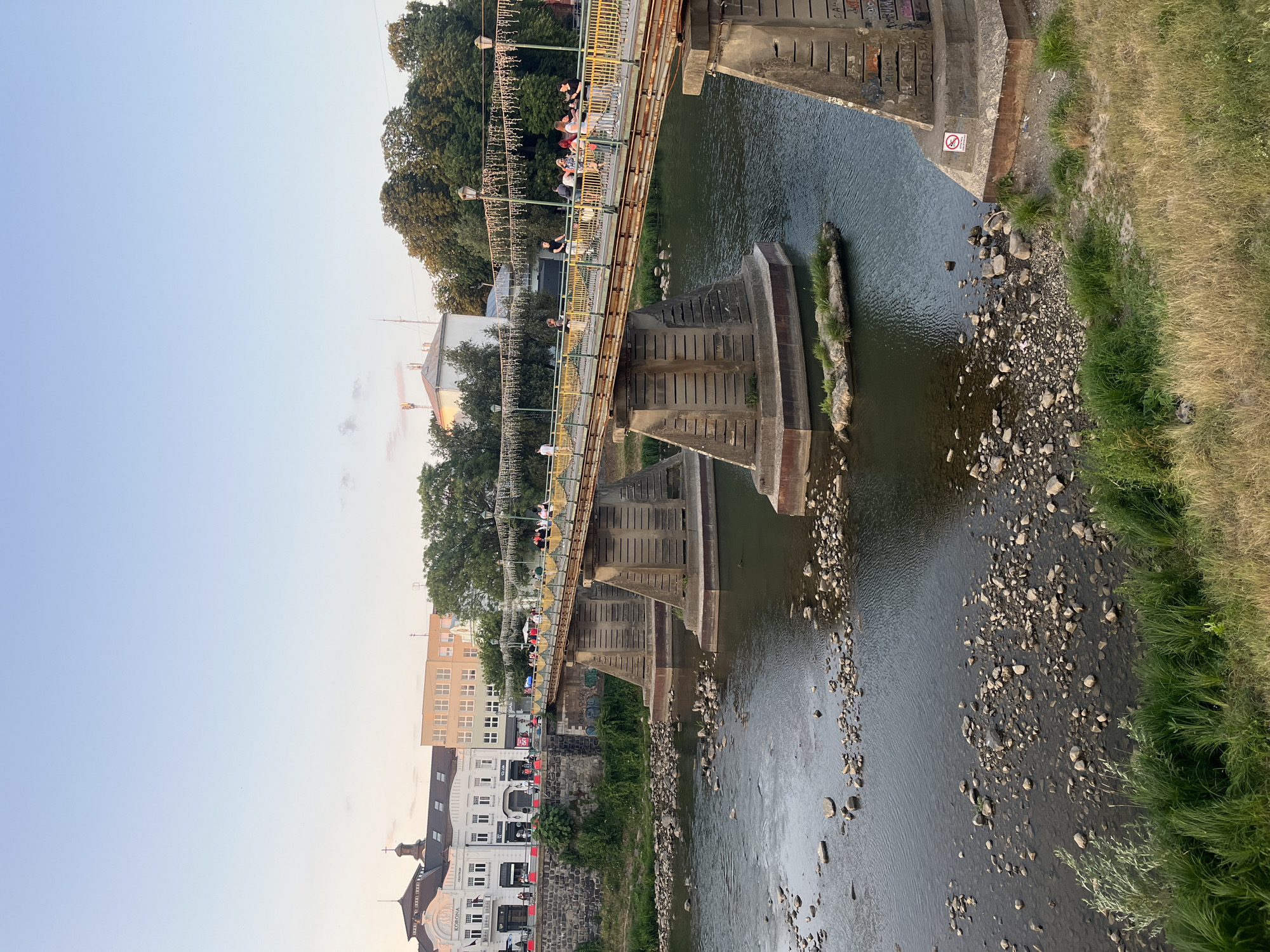 Sunset walk along Uzhhorod's Uzh River embankment and bridge