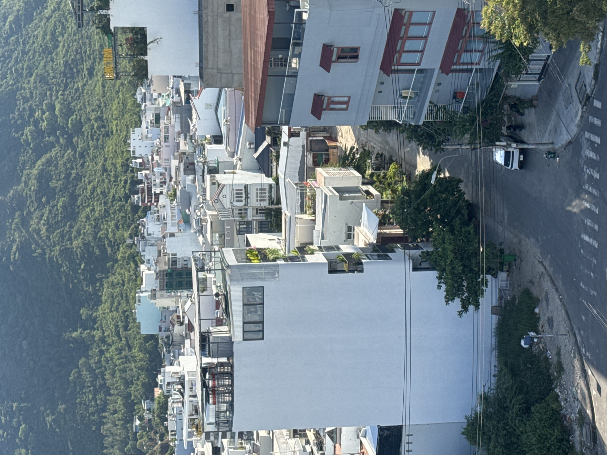 Nha Trang cityscape morning: construction smoke, hills, and street life
