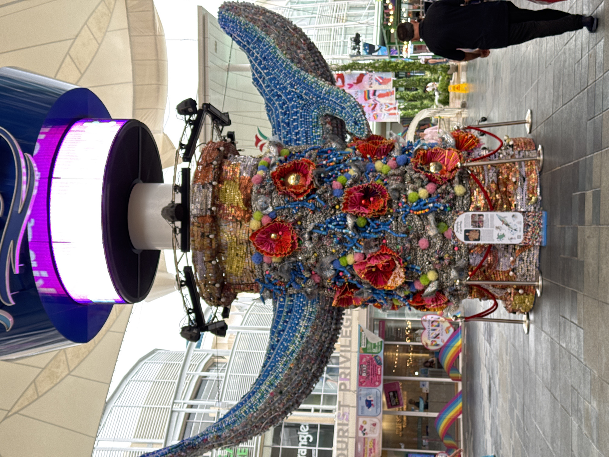 Patong street scenes and a mosaic whale sculpture on a rainy morning