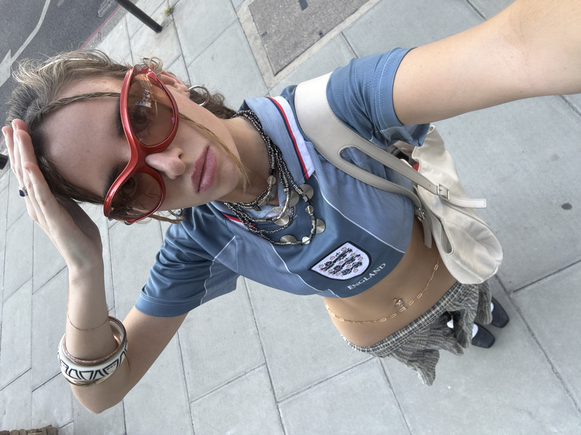 England football jersey selfies on a London street