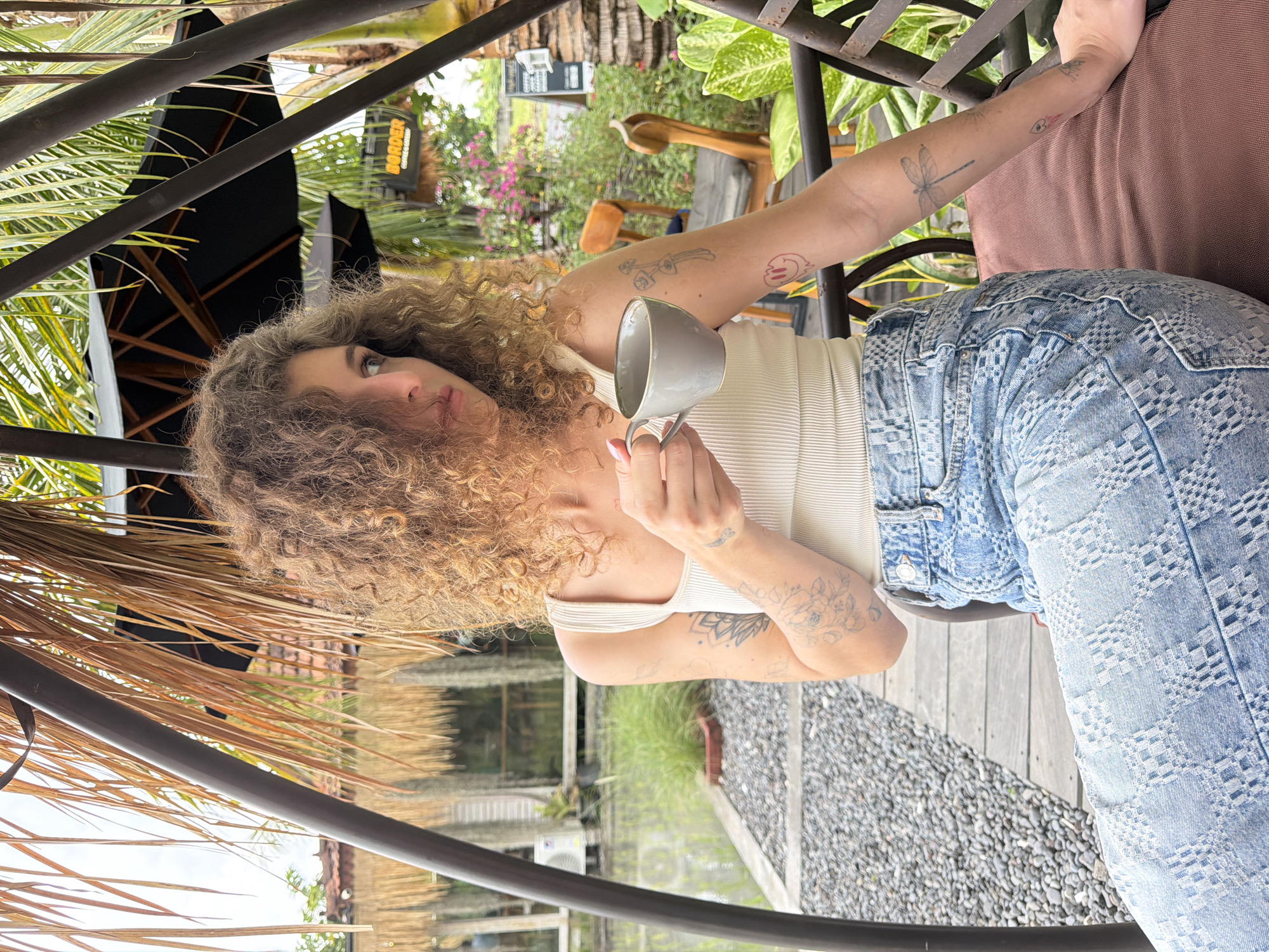Morning coffee culture documented at Mengwi cafe amid rice paddies
