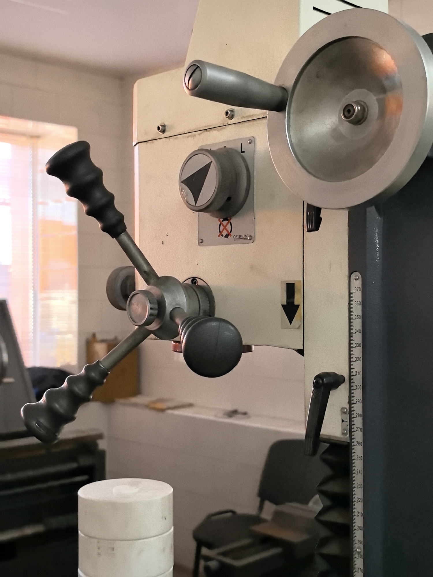 Inside a well-equipped metalworking workshop with industrial machinery
