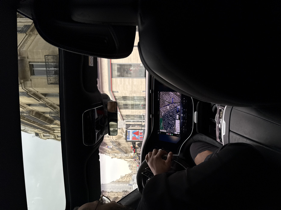 Vehicle interior documented from passenger perspective in Paris