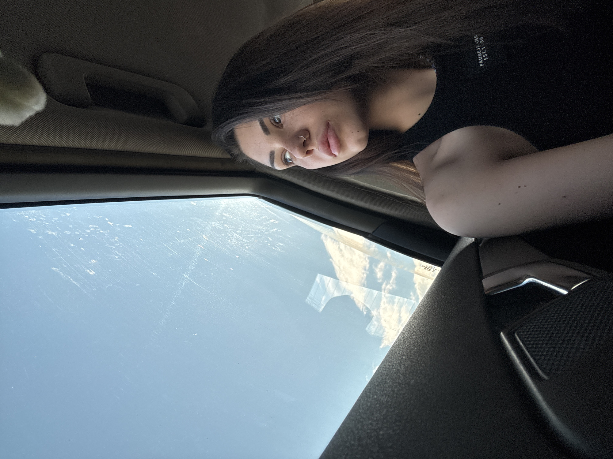 Woman photographed looking out car window in Voluyak, Bulgaria