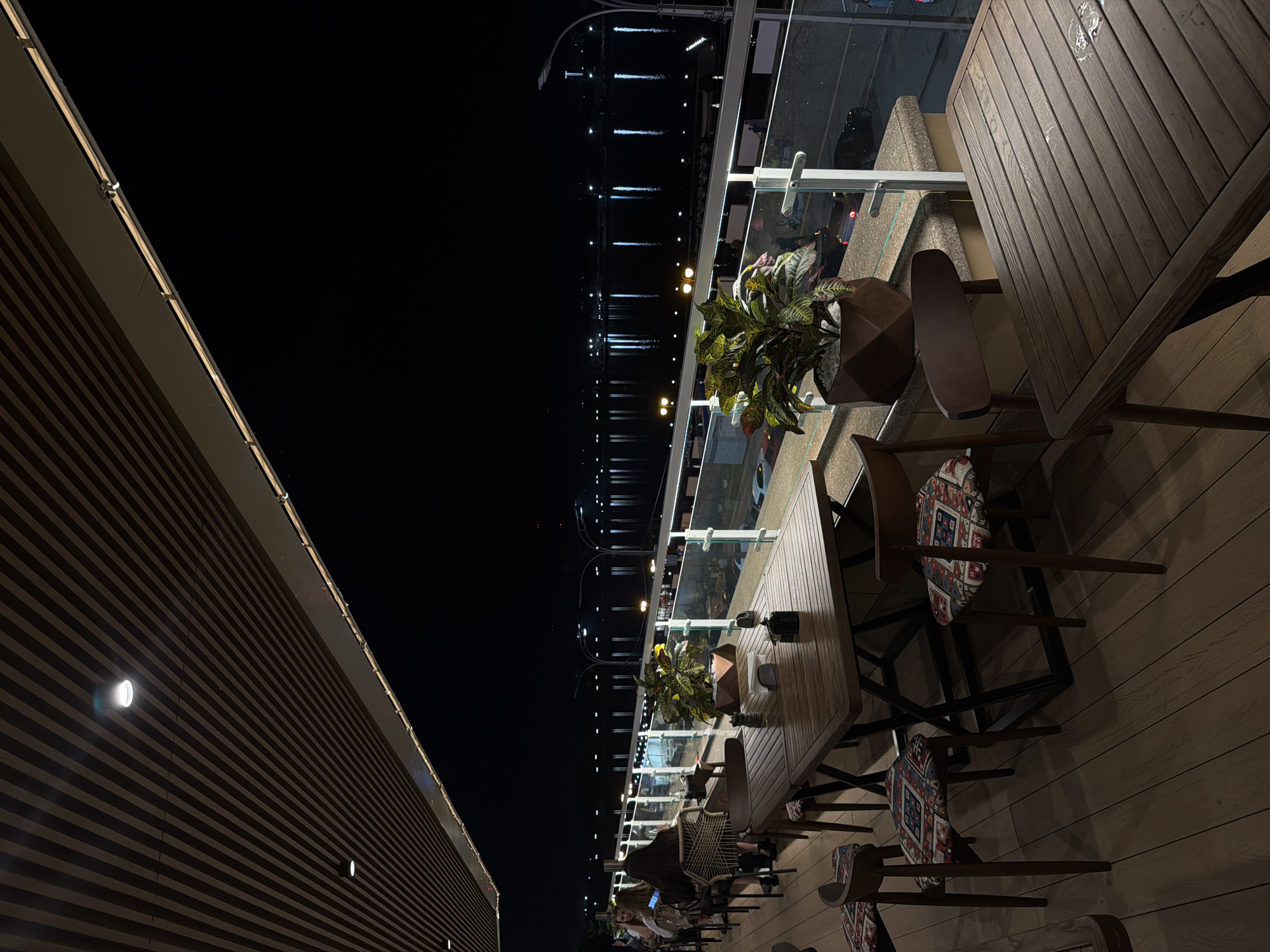 Waterside restaurant observed during evening hours